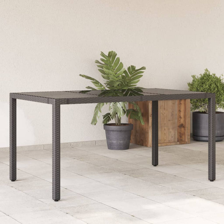 Tuintafel met glazen blad 150x90x75 cm poly rattan zwart